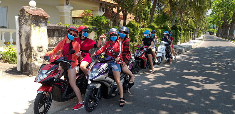Commuting in Hoi An by Motorbike