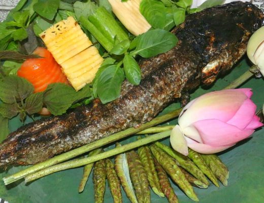 Grilled snakehead fish wrapped in young lotus leaves